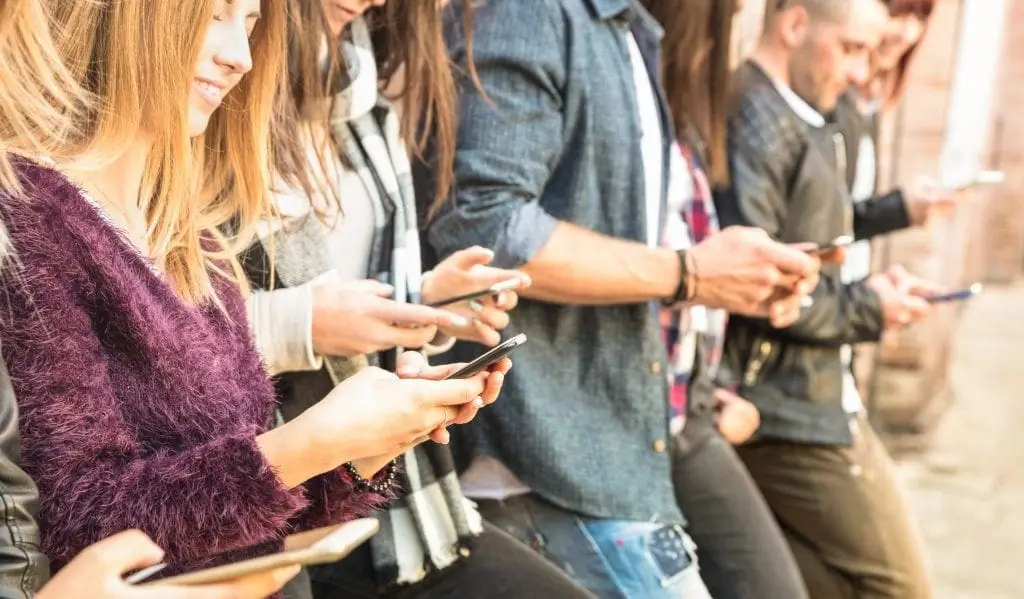 Group of friends using smartphone